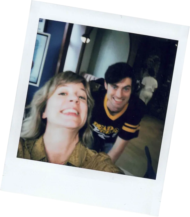 Polaroid of two employees smiling